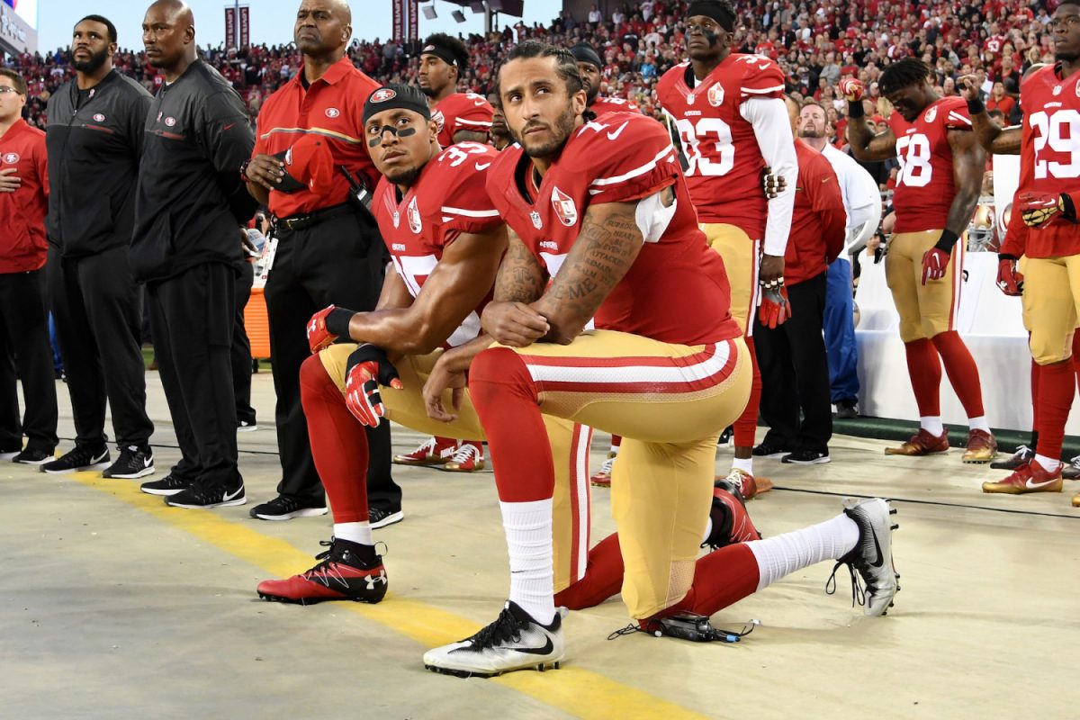Colin Kaepernick kneels in protest during the national anthem in 2016.