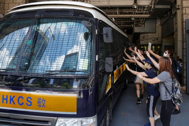 Supporters bid farewell to a prison van